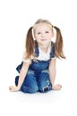 Little smiling girl in blue jeans