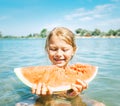 Little smiling Girl eating red watermelon portrait on the beach Royalty Free Stock Photo