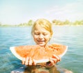 Little smiling Girl eating red watermelon portrait on the beach Royalty Free Stock Photo