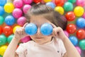 .Little girl playing lying in ball park. Close-up, portrait Royalty Free Stock Photo