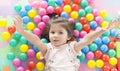 .Little girl playing lying in ball park. Close-up, portrait Royalty Free Stock Photo