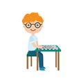 Little boy playing chess isolated against white background Royalty Free Stock Photo