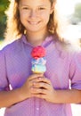 Little smilling girl holding ice cream cone Royalty Free Stock Photo