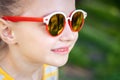 Little smily girl in cool sunglasses Royalty Free Stock Photo