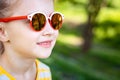 Little smily girl in cool sunglasses Royalty Free Stock Photo