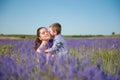 Little son kissing his mother among flowering lavender field Royalty Free Stock Photo