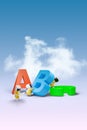 Little spacemen lifting colorful ABC alphabets.