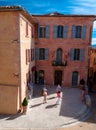 Little square and buildings in Roussillon village in France