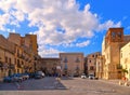 25.08.2018. little square with old classical colorful buildings, church dome and cloudy blue sky in coastal town Licata in Sicily,