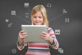 Little standing girl with tablet with icons on screen.