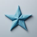 Little Star: Blue Origami Star On Gray Background Stock Photo
