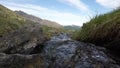 Little stream flowing in idyllic uncontaminated environment on the Italian Alps.