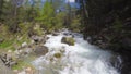 Little stream flowing in idyllic uncontaminated environment