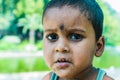 Little street boy from Indian ethnicity staring