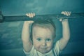 Little strong baby toddler playing sports in gym. Kid during his workout. Success and winner concept. Toning foto.