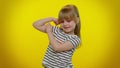 Little strong kid child girl showing biceps and feeling power strength, energy to gain success win