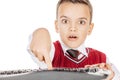 little student boy with keyboard isolated on white studio background. education, school and future technology concept Royalty Free Stock Photo