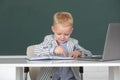 Little student child studying in classroom at elementary school. Kid writing in class. Education and kids knowledge Royalty Free Stock Photo