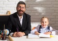 Little student girl happy with an excellent mark. Cute little preschool kid and smiling teacher in a classroom. Cute Royalty Free Stock Photo