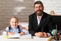 Little student girl happy with an excellent mark. Cute little preschool kid and smiling teacher in a classroom. Cute Royalty Free Stock Photo