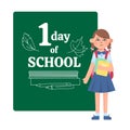 Little student girl standing at the school blackboard with First day of school lettering Royalty Free Stock Photo