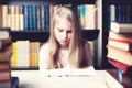 Little student girl studying and reading book at school Royalty Free Stock Photo