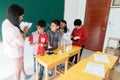 Little students study science in classroom