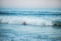 Little surfer learn to ride on surfboard on sea wave. Father with son play in summer ocean, learning surfing. Little boy swim on Royalty Free Stock Photo