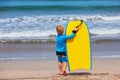 Little surfer run with bodyboard on sea beach Royalty Free Stock Photo