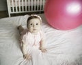 Little sweet girl plays with fitness ball on a white background. Healthy lifestyle. Gymnastics for children Royalty Free Stock Photo