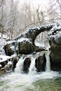 Mullerthal, Luxembourg - January 2024 - Schiessentumpel Waterfall under snow Royalty Free Stock Photo