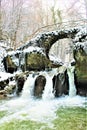 Mullerthal, Luxembourg - January 2024 - Schiessentumpel Waterfall under snow Royalty Free Stock Photo