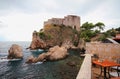 Little table in cafe overlooking fort of Lovrenach (Saint Lavrenti). Dubrovnik, Croatia Royalty Free Stock Photo