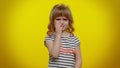 Little teen child kid girl closing eyes with hand showing stop gesture, confused shy scared to watch Royalty Free Stock Photo