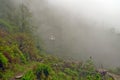 Little temple on hill in fog near Landruk, Annapurna Conservation Area, Himalaya Mountains