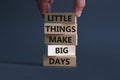 Little things make big days symbol. Wooden blocks with words Little things make big days. Businessman hand. Beautiful grey