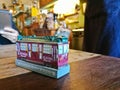 Little tiny Melbourne toy model in a cozy restaurant with many people