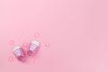 Little tiny pink baby girl shoes and pink textile hearts, copy space, top view Royalty Free Stock Photo