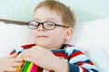 Little tired boy sleeping with book in bed Royalty Free Stock Photo