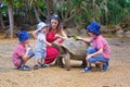 Little toddle boy, feeding giant tortois, baby got bitten, mom having terrified look on her face