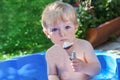 Little toddler boy eating ice cream in cone Royalty Free Stock Photo