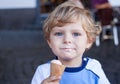 Little toddler boy eating ice cream in cone Royalty Free Stock Photo