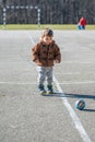 Little toddler boy, playing with ball on playground Royalty Free Stock Photo