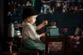 Little toddler boy, playing with mill at home, sitting on vintage table Royalty Free Stock Photo