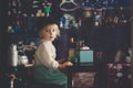 Little toddler boy, playing with mill at home, sitting on vintage table Royalty Free Stock Photo