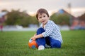 Little toddler boy playing soccer and football, having fun outdo Royalty Free Stock Photo