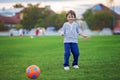 Little toddler boy playing soccer and football, having fun outdo Royalty Free Stock Photo