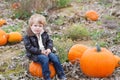 Little toddler boy on pumpkin field Royalty Free Stock Photo