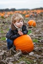 Little toddler boy on pumpkin field Royalty Free Stock Photo