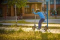 Little toddler boy riding and his scooter Royalty Free Stock Photo